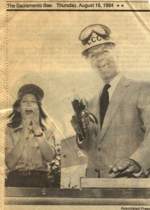 Photo of Sacramento Bee news clipping featuring excited Corpsmember and Gov. Deukmejian holding a power tool