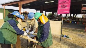 image Corpsmembers building fire base camp sign