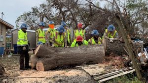 image Corpsmembers pushing log