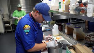 image Corpsmember working in kitchen