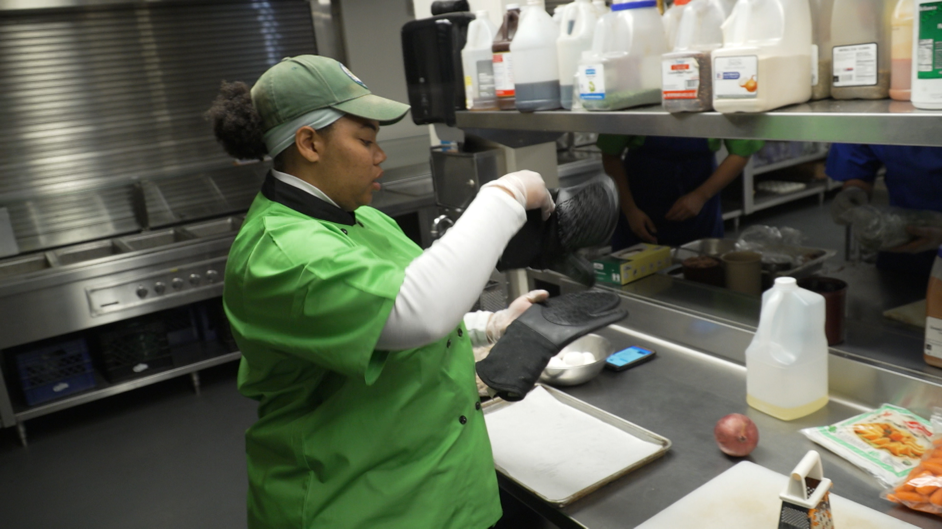 Corpsmember working in kitchen