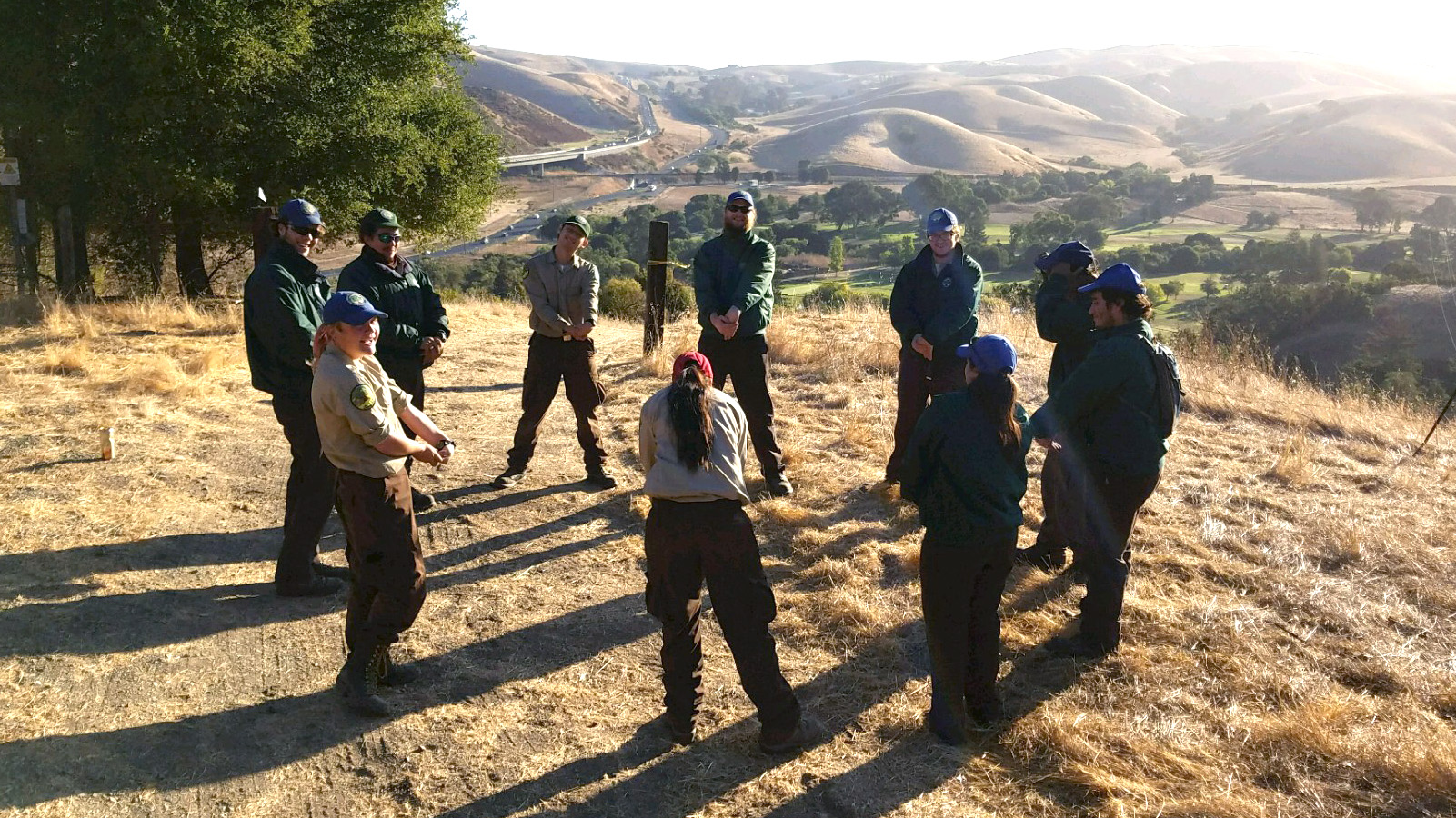 Solano Center Corpsmembers stretching before starting work.