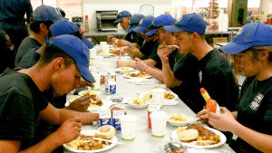 Corpsmembers eating breakfast.