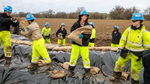 corpsmembers working on levee repair