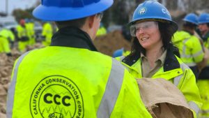 female smiling as passing sandbag