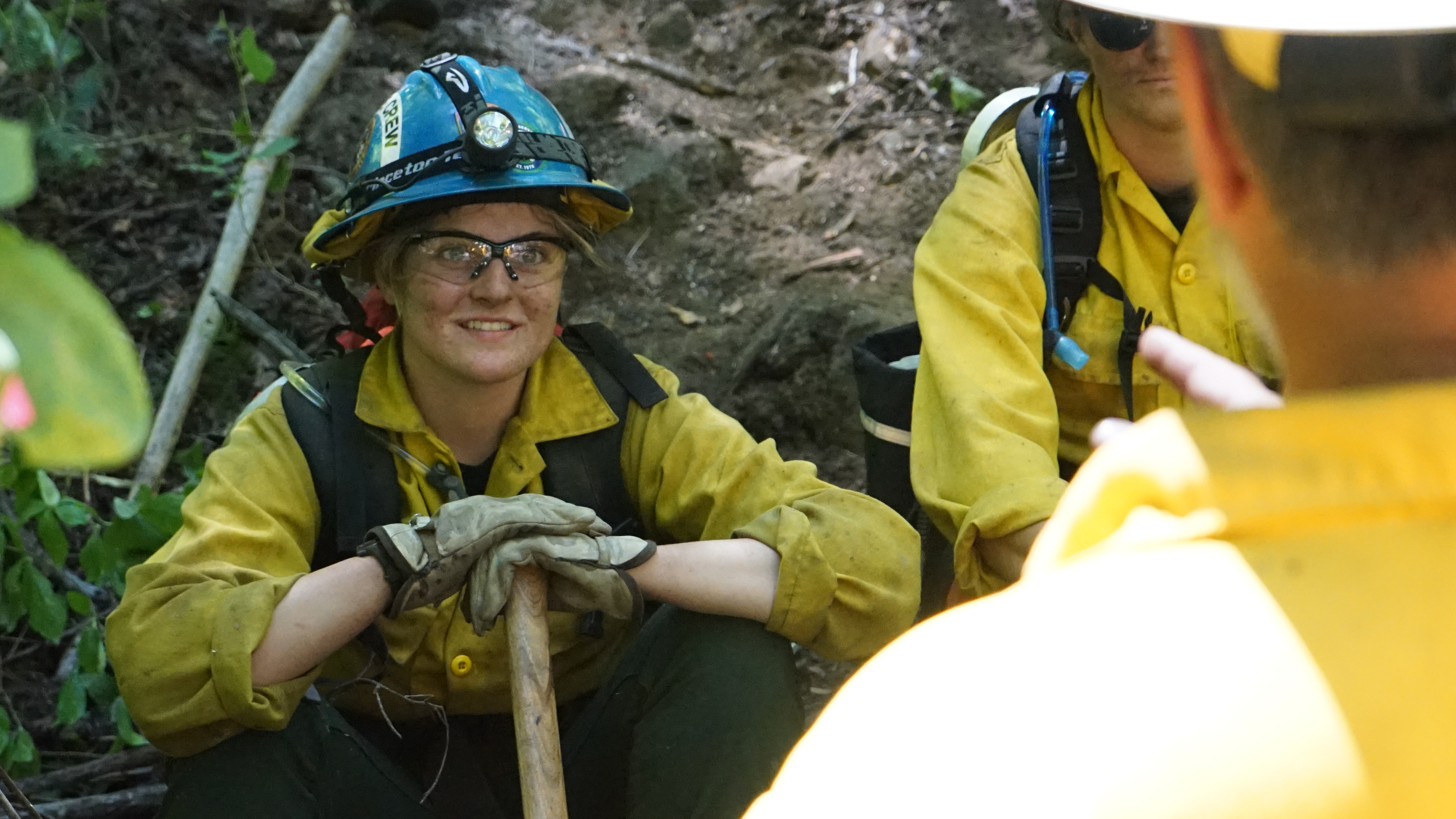female smiling in fire gear