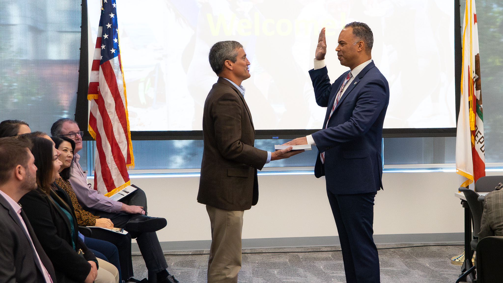 JP Patton (right) gets sworn in as as CCC Director .