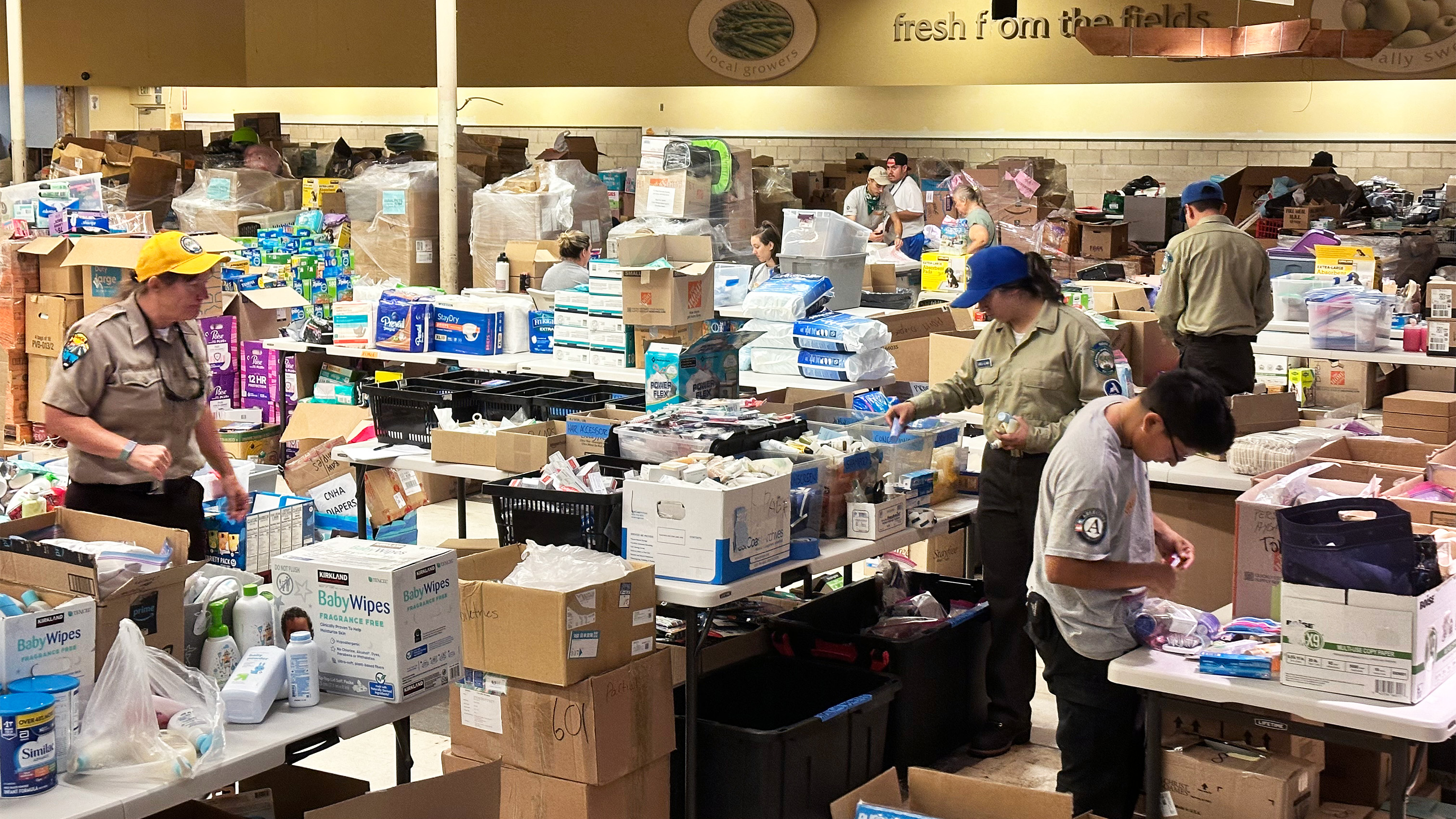 CCC Corpsmembers sort and distribute supplies to survivors of the Lahaina Fire.