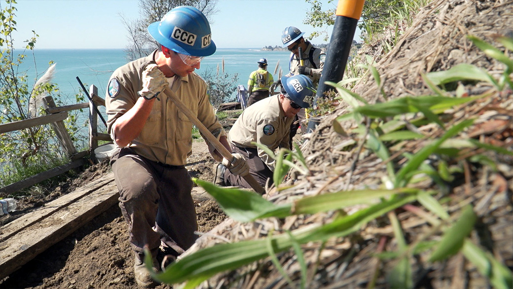 Using hand tools, Monterey Bay Corpsmembers dug through mud and vegetation to re-open a trail connecting New Brighton State Beach to the bay below.