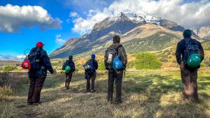 Corpsmembers look toward the Andean Mountain Range in Torres Del Paine National Park.
