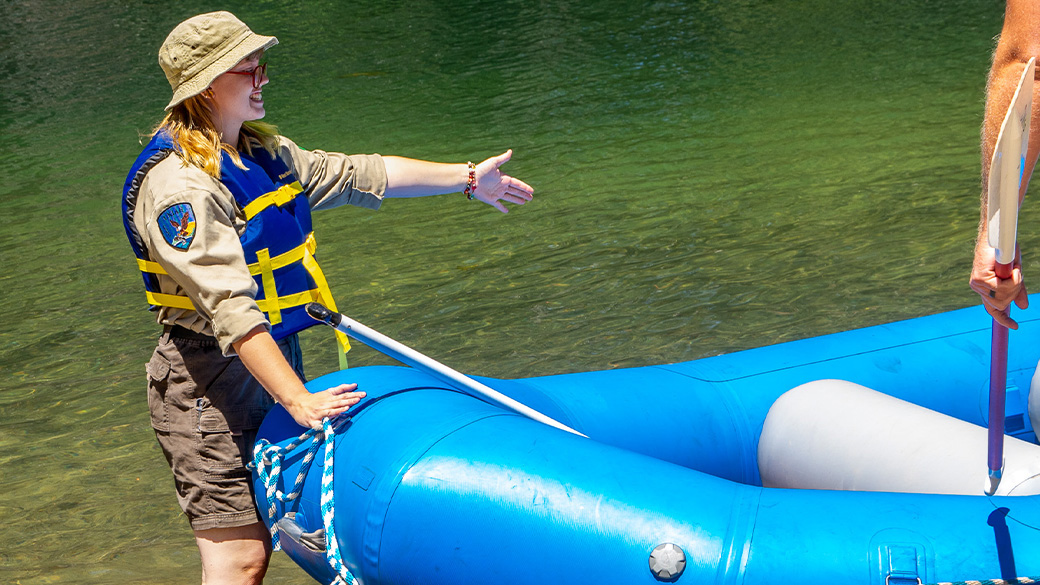 Corpsmember next to raft. 