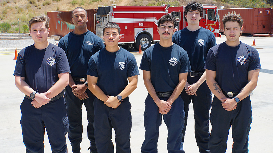 portrait of six men in cal fire t-shirts