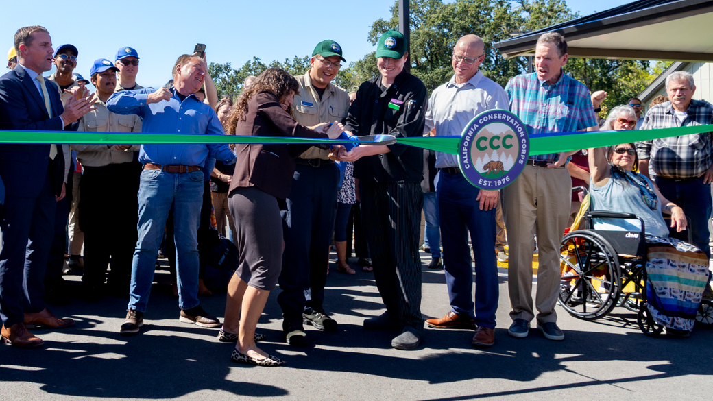 Corpsmembers and Deputy Director Sloane Viola cut the ribbon at CCC Mendocino Center
