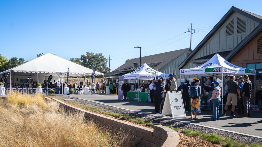 Staff, Corpsmembers, community partners, and members of the public check-in and get seated at the CCC Mendocino Center opening.