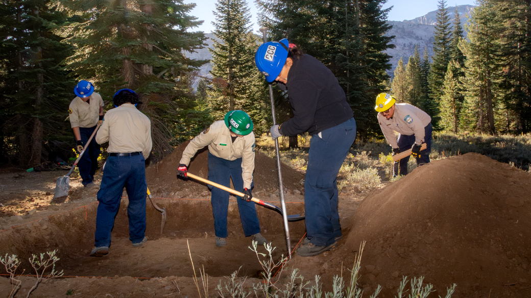 CCC Corpsmember digging a 9x9 pit to house the weather station's base.