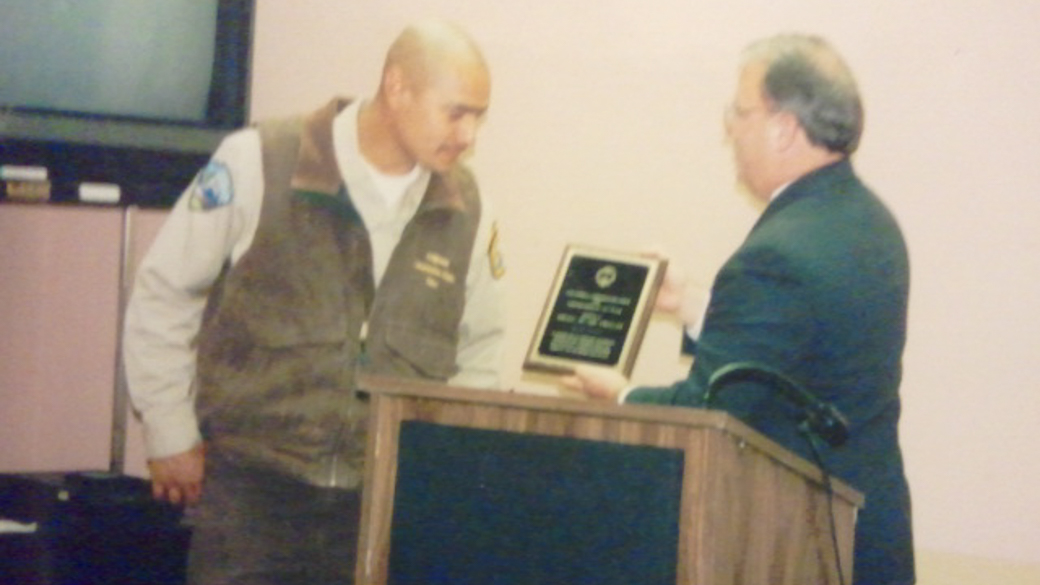 Ismael Delosangeles receives an award.