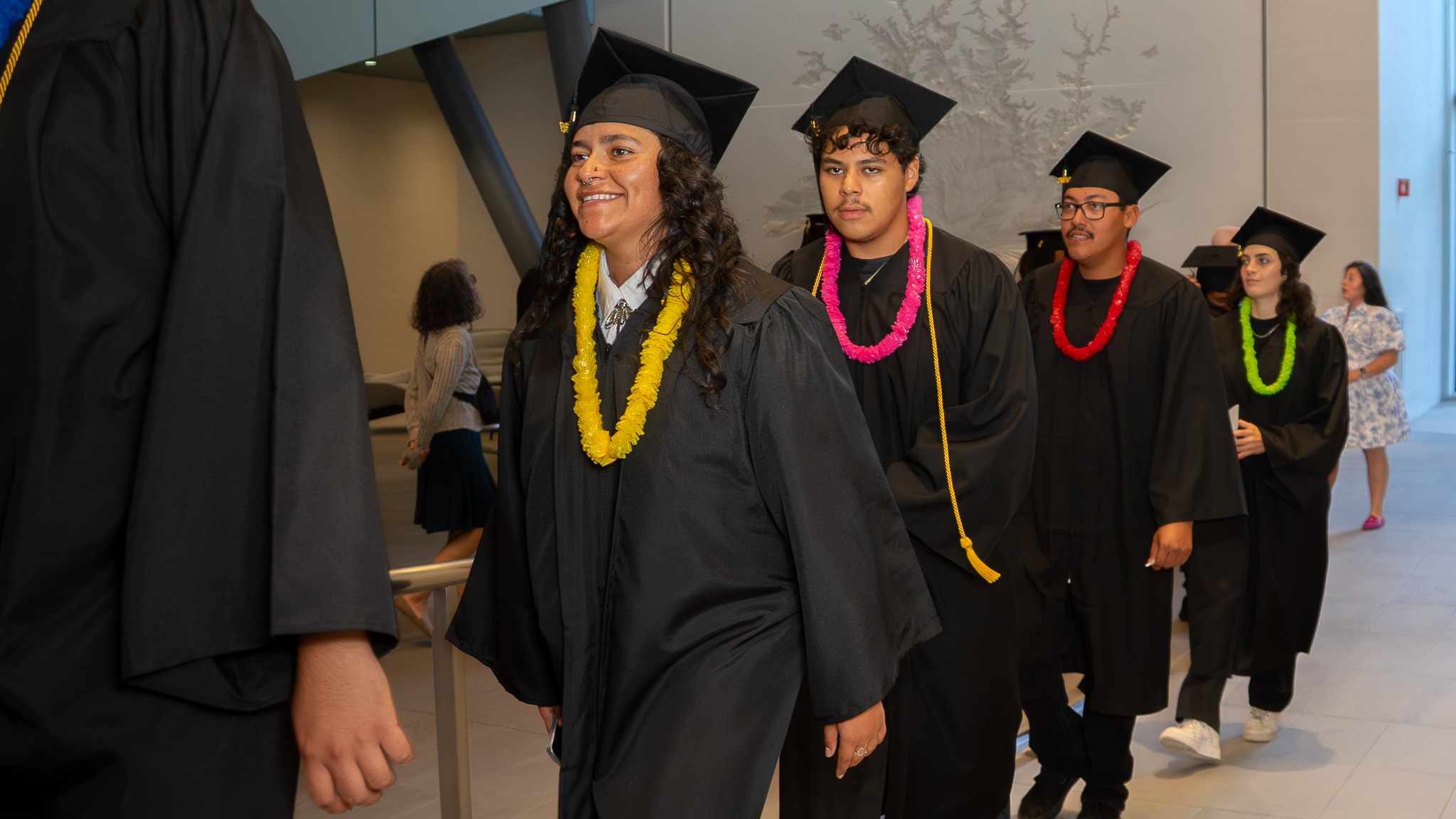 CCC Corpsmembers line up and walk into their graduation.