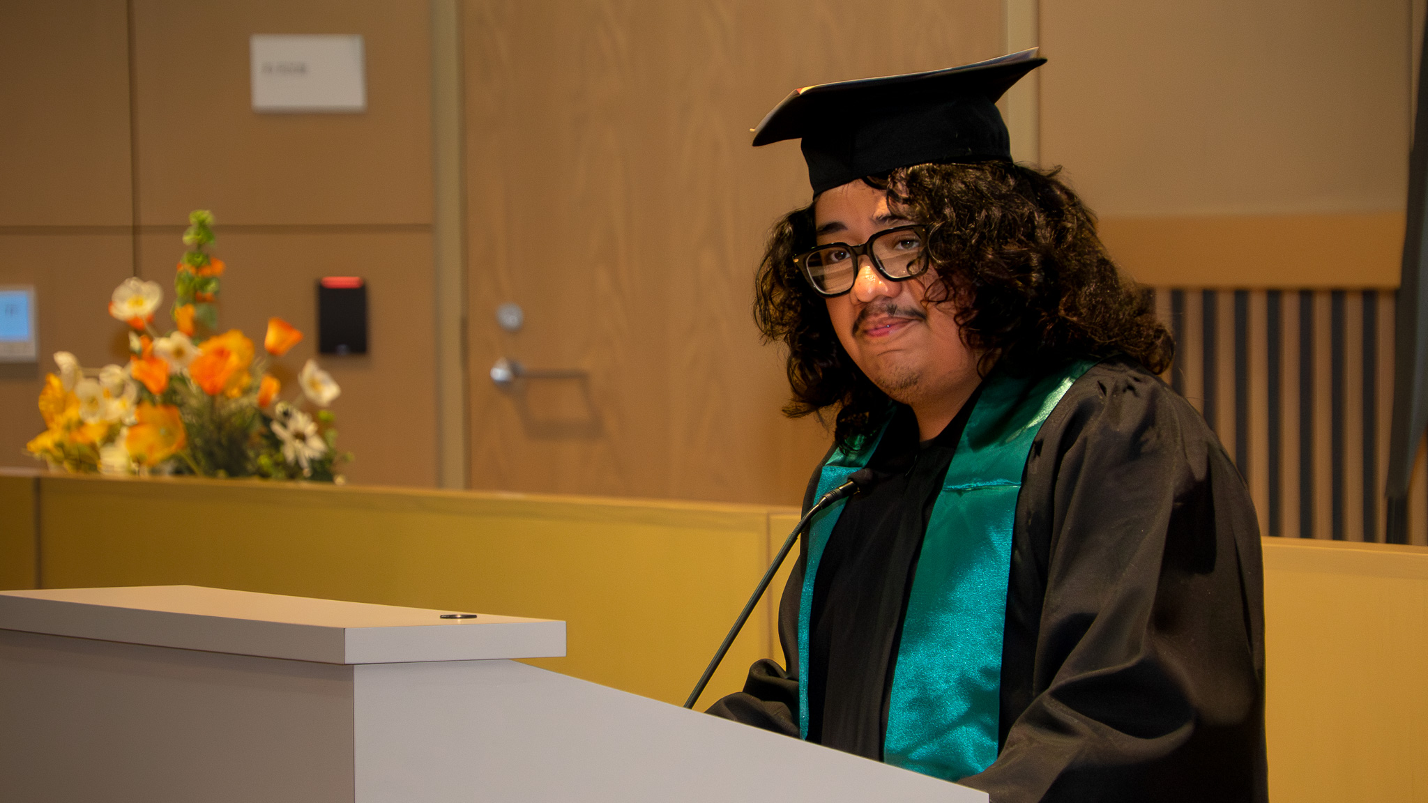 A CCC Corpsmember gives a speech during graduation.