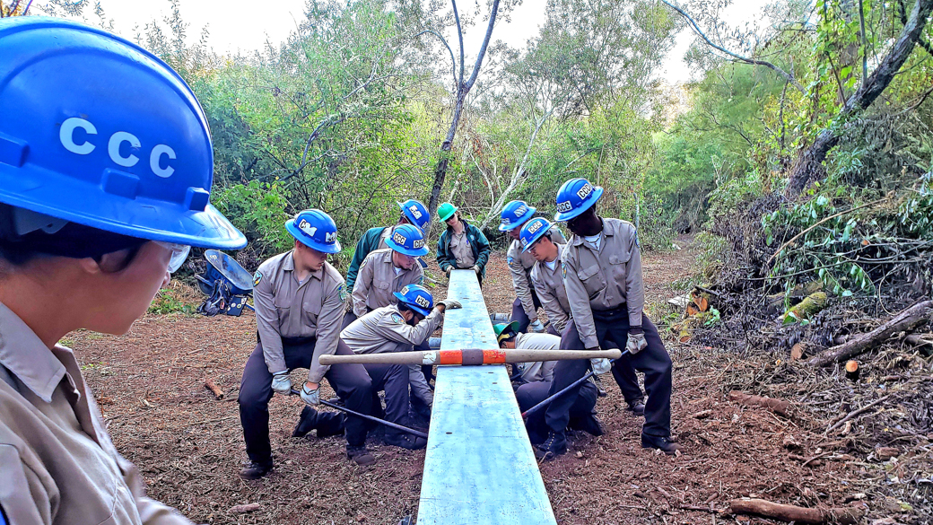 A crew from the Ukiah Center replaces a bridge beam. 
