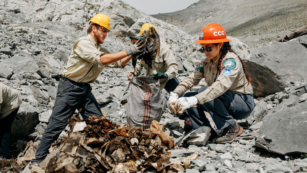 CCC Corpsmembers work alongside their Ecogenia counterparts in Greece, clearing waste off Mount Olympus. 