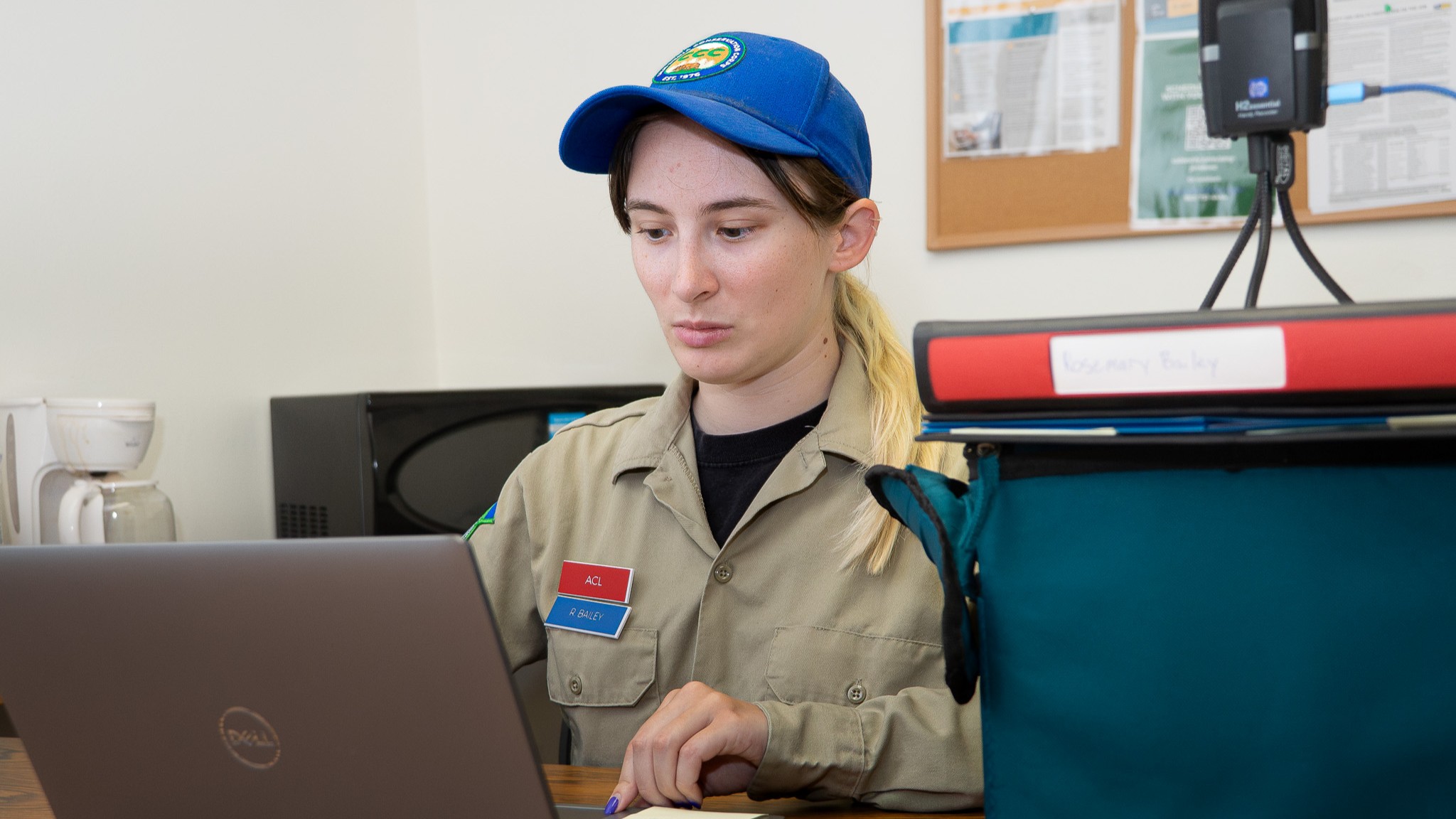 Corpsmember intern using their laptop.